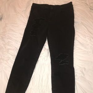 Black distressed skinny jeans.